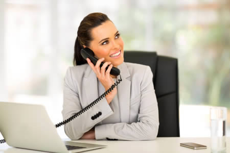 business woman on phone in small office  Copyright: <a href='http://www.123rf.com/profile_michaeljung'>michaeljung / 123RF Stock Photo</a>